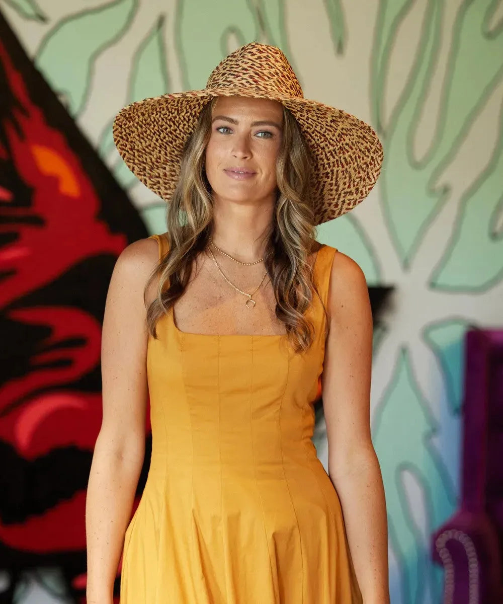 Women's wide brim fedora sun hat from Peter Grimm Inca in natural straw with a stylish hatband, perfect for sun protection.