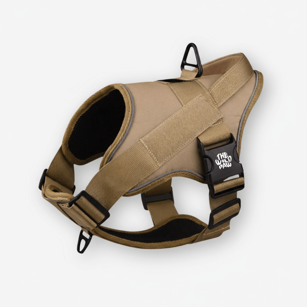 Tan TrailBlaze Tactical Harness by The Wild Paw with logo, featuring adjustable straps and sturdy design for outdoor use.