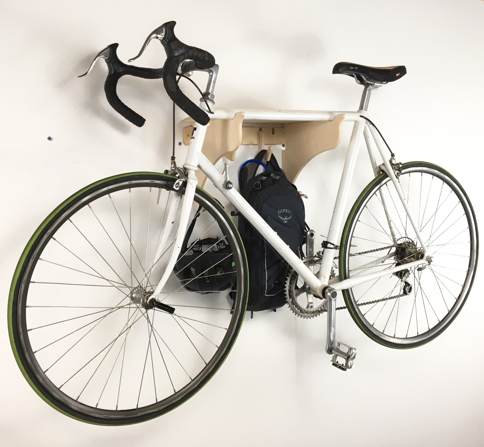 Rado Racks Roadie bike shelf and rack mounted on wall, showcasing durable metal construction and space-saving design for bikes.