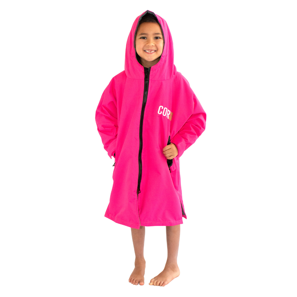 Kids pink waterproof swim parka by COR Surf, lightweight and protective, suitable for children aged 4-7, outdoor swimwear apparel.