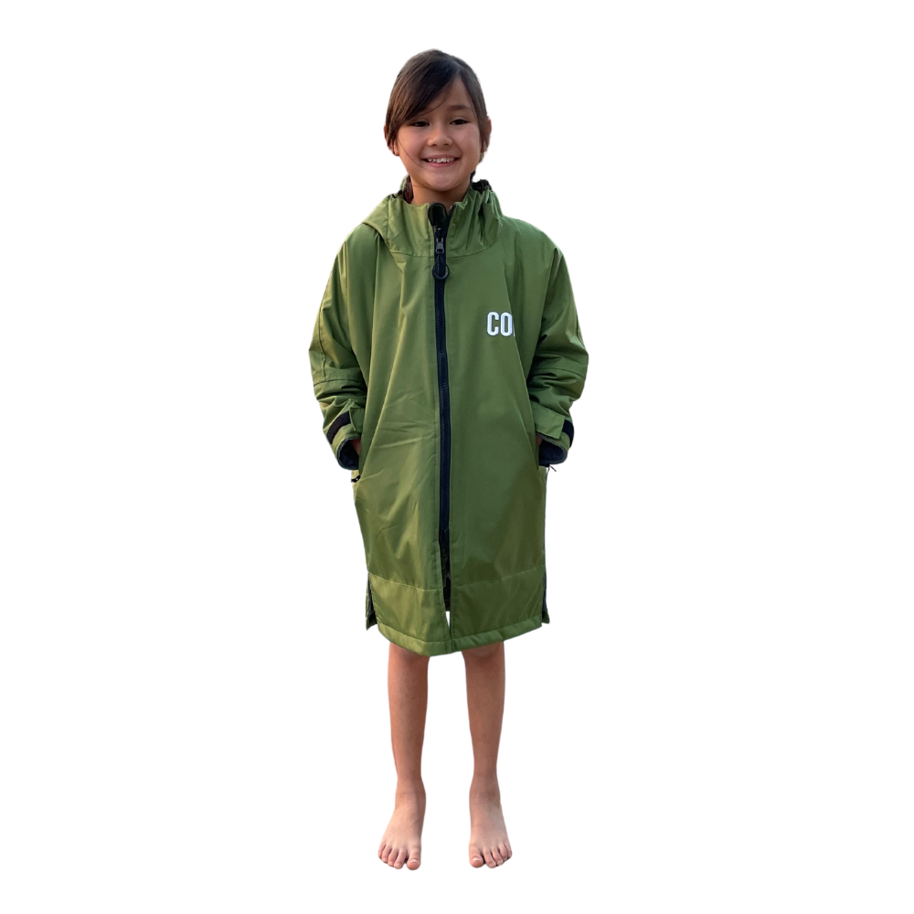 Kids waterproof swim parka in green by COR Surf, featuring a cozy hood and lightweight, rainproof design for outdoor swimming.