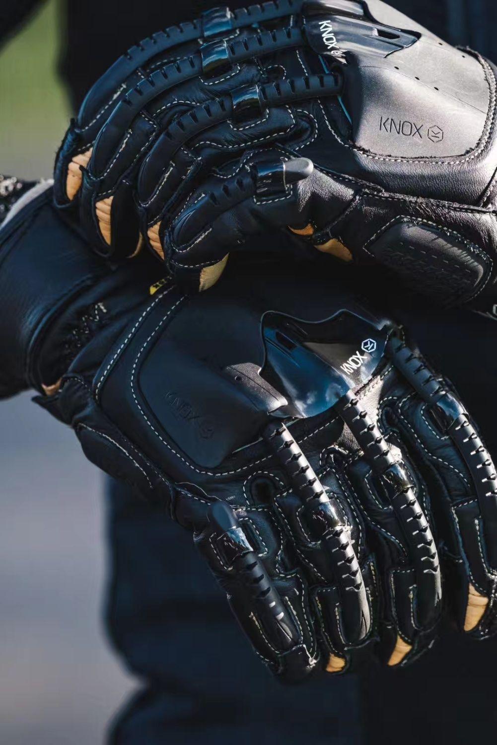 Black Knox Handroid MK4 motorcycle gloves with protective armor and textured grip, designed for motorcycle riding.