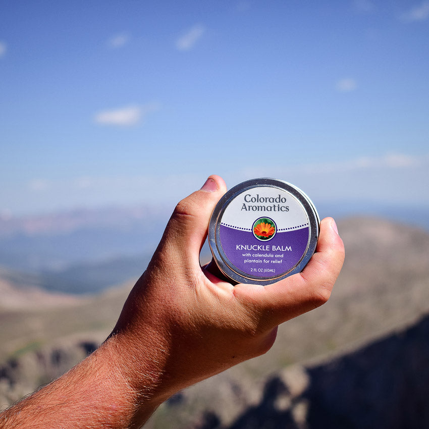 Colorado Aromatics moisturizing body balm for knuckles, featuring a natural formula in a convenient jar.