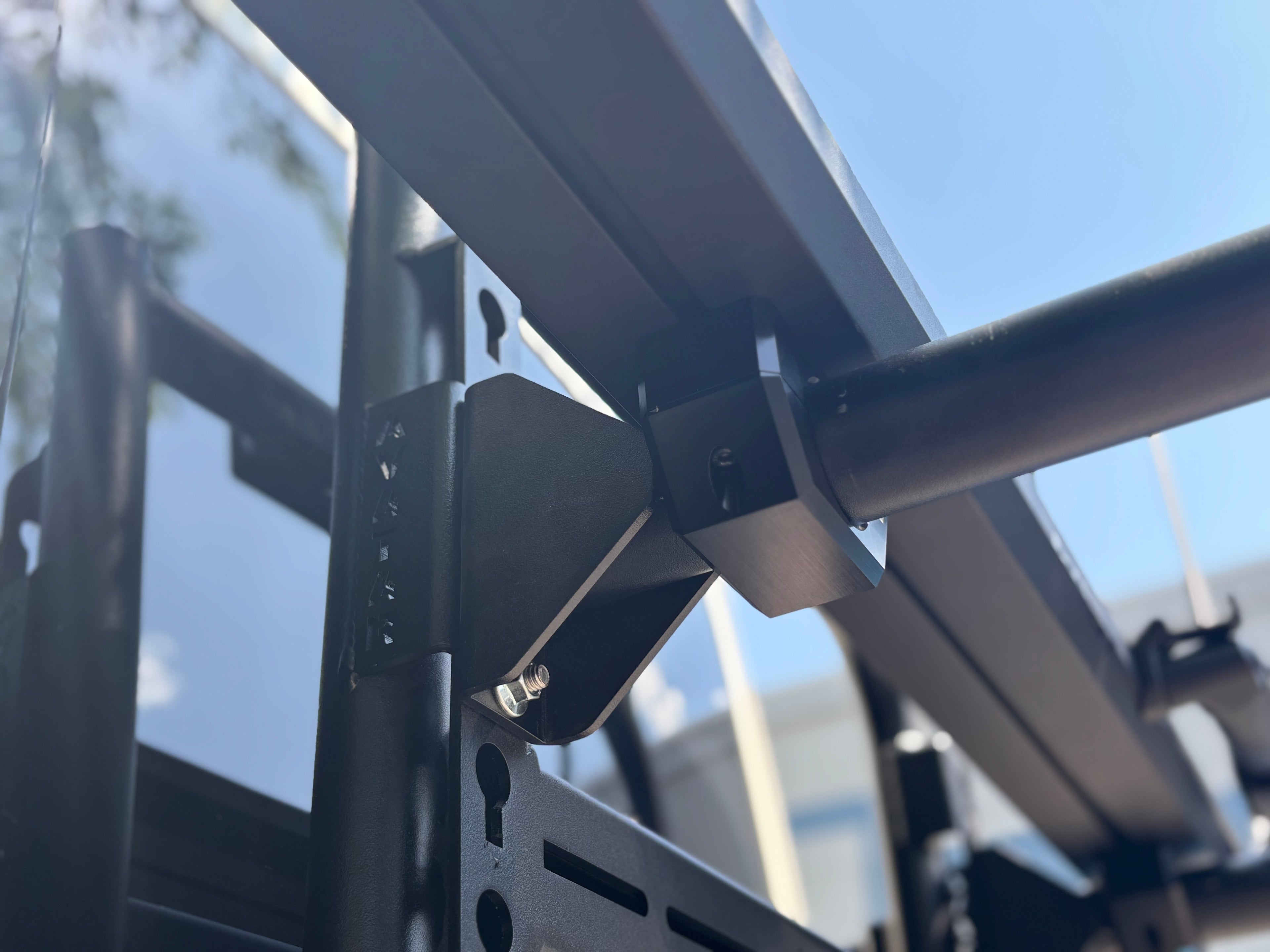 Avatar Offroad Kuat Piston SR bike mount attached to Vans, designed for secure bike storage on vehicle roof racks.