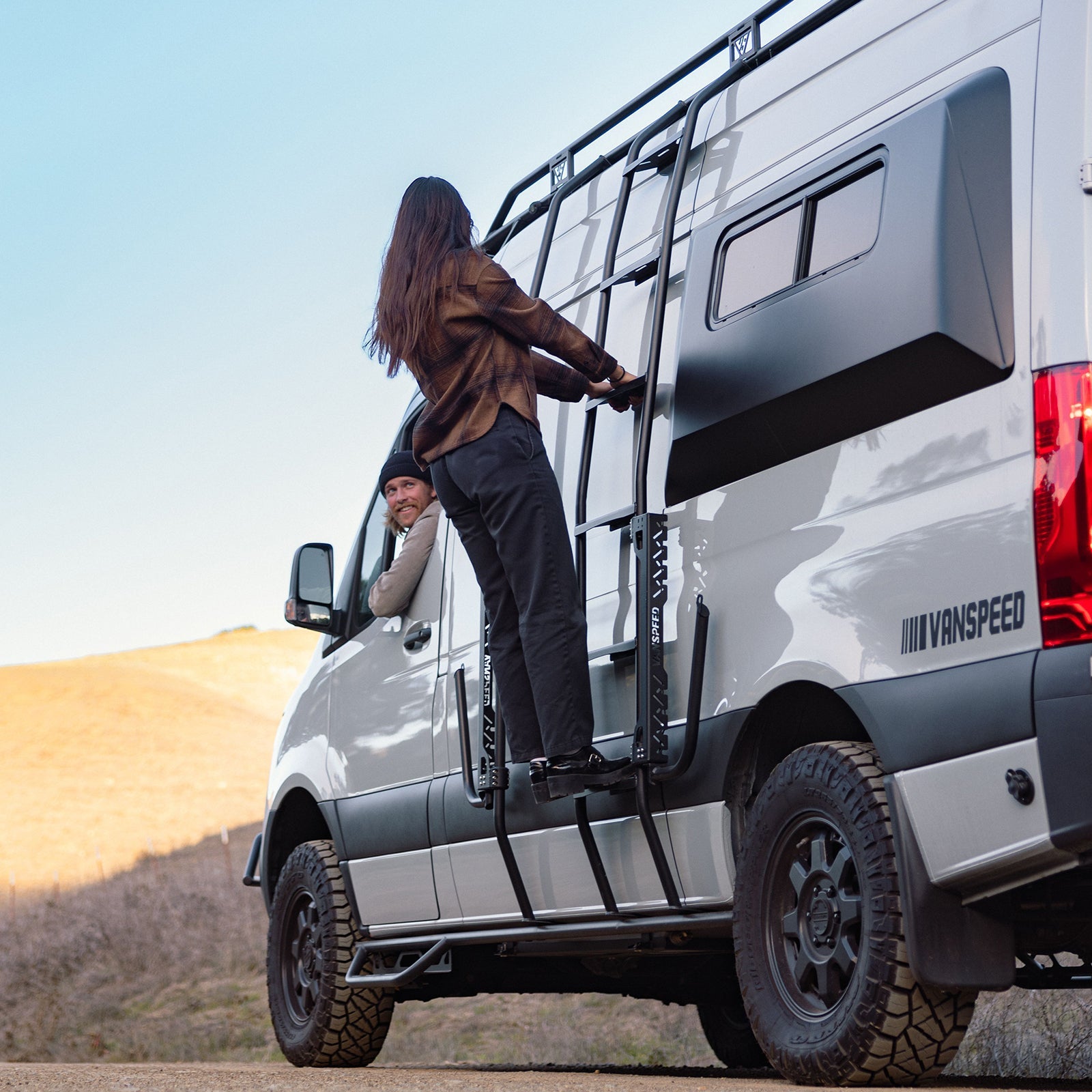 Sprinter Exterior Surf Rack Set by The Van Mart mounted on a van, showcasing sturdy design for carrying surfboards.