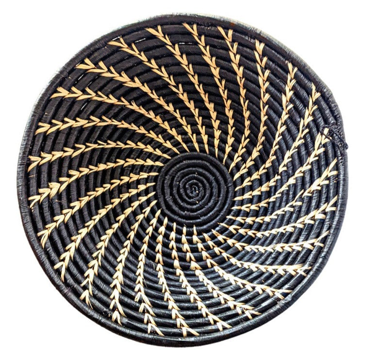 Large black and white woven African basket by Reflektion Design, showcasing intricate woven patterns and textured surface.