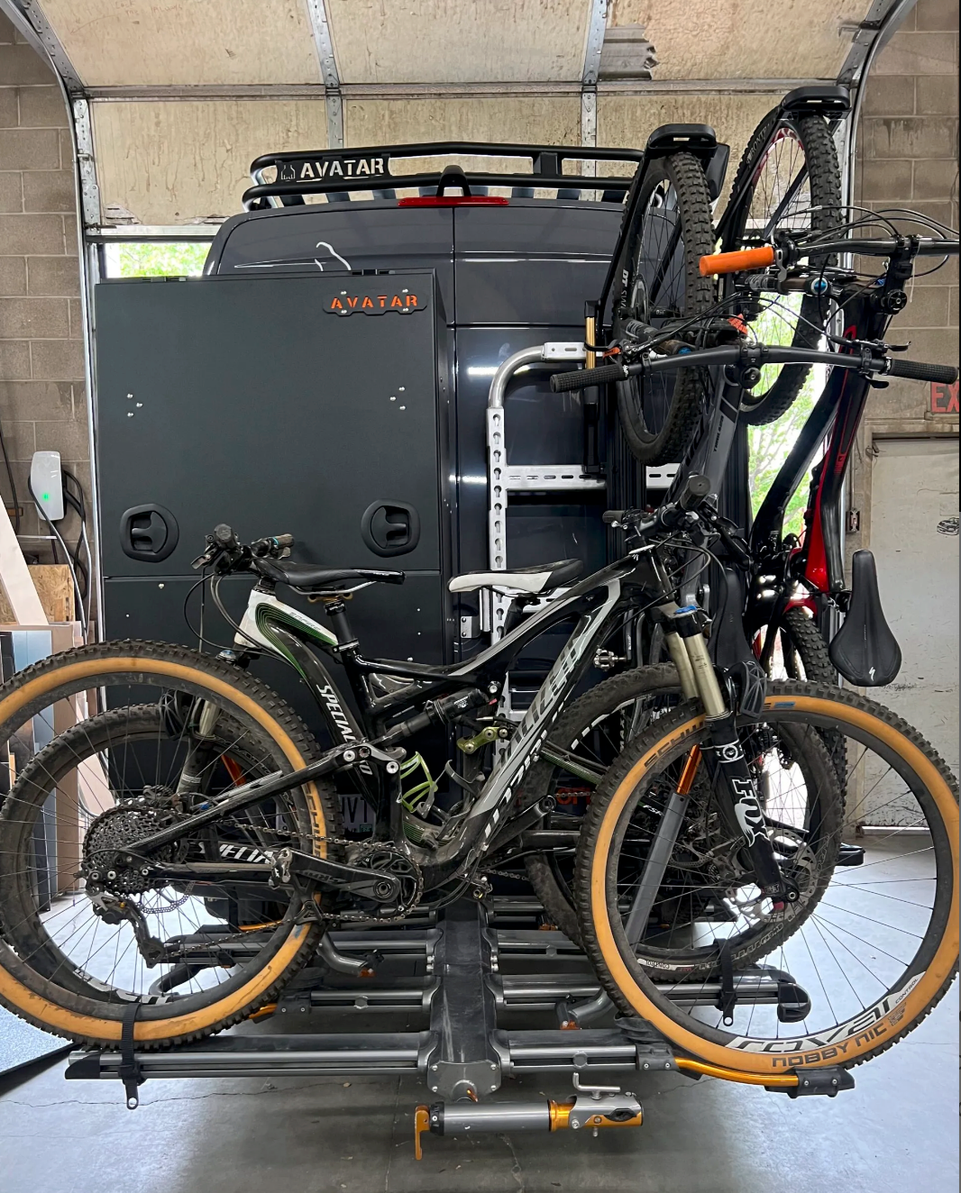 Avatar Offroad Giga Storage Box with large rear doors, ideal for bike and gear storage in rugged outdoor settings.
