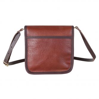 Backcountry Sportsman Bison Leather Mini Haversack with adjustable strap and compact design, shown in rich brown leather.