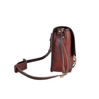 Backcountry Sportsman Bison Leather Mini Haversack shown from side view with adjustable strap and compact, rugged design.