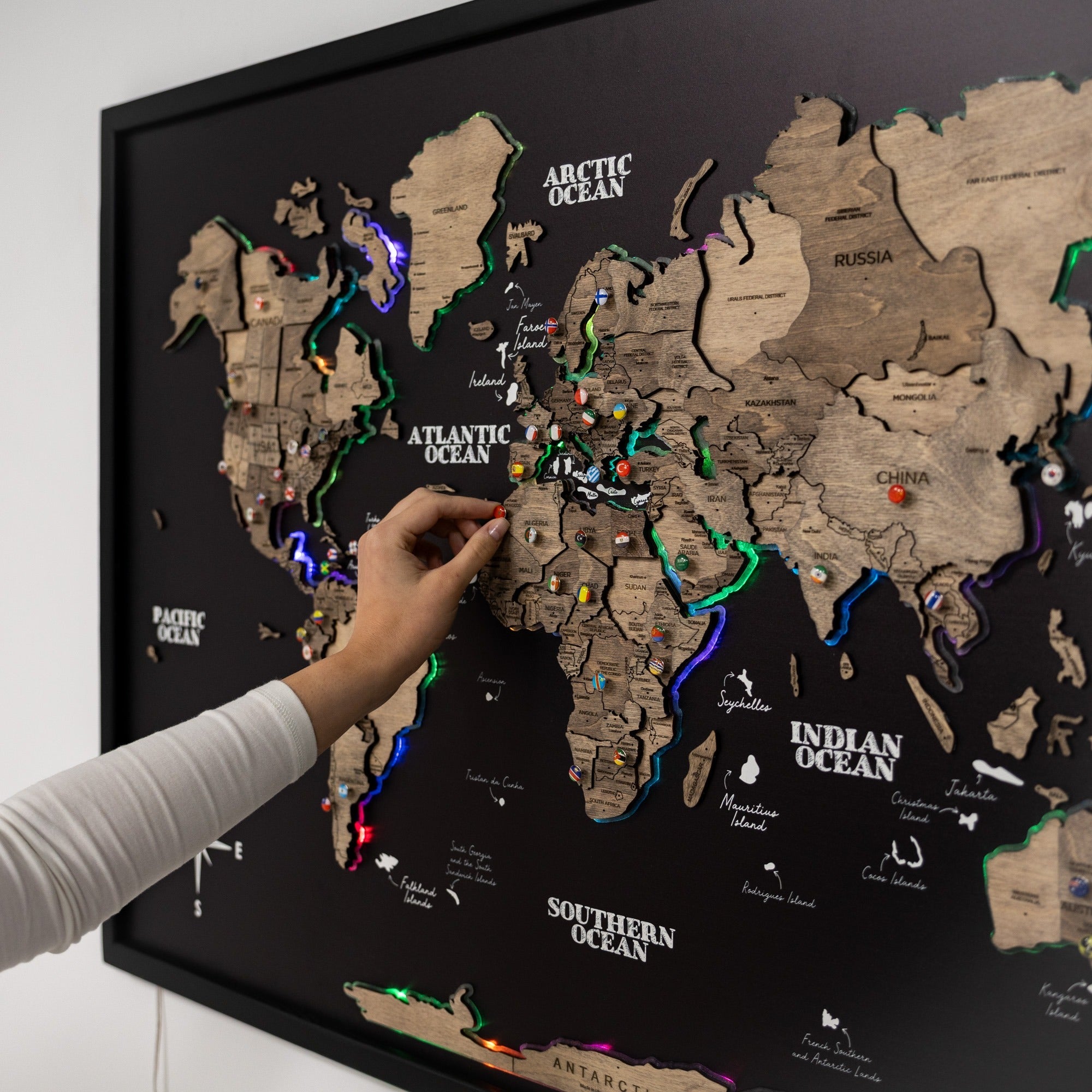 Panel Map LED 2.0 by Enjoy The Wood, illuminated map on a wooden board with vibrant LED lighting and detailed geographic features.