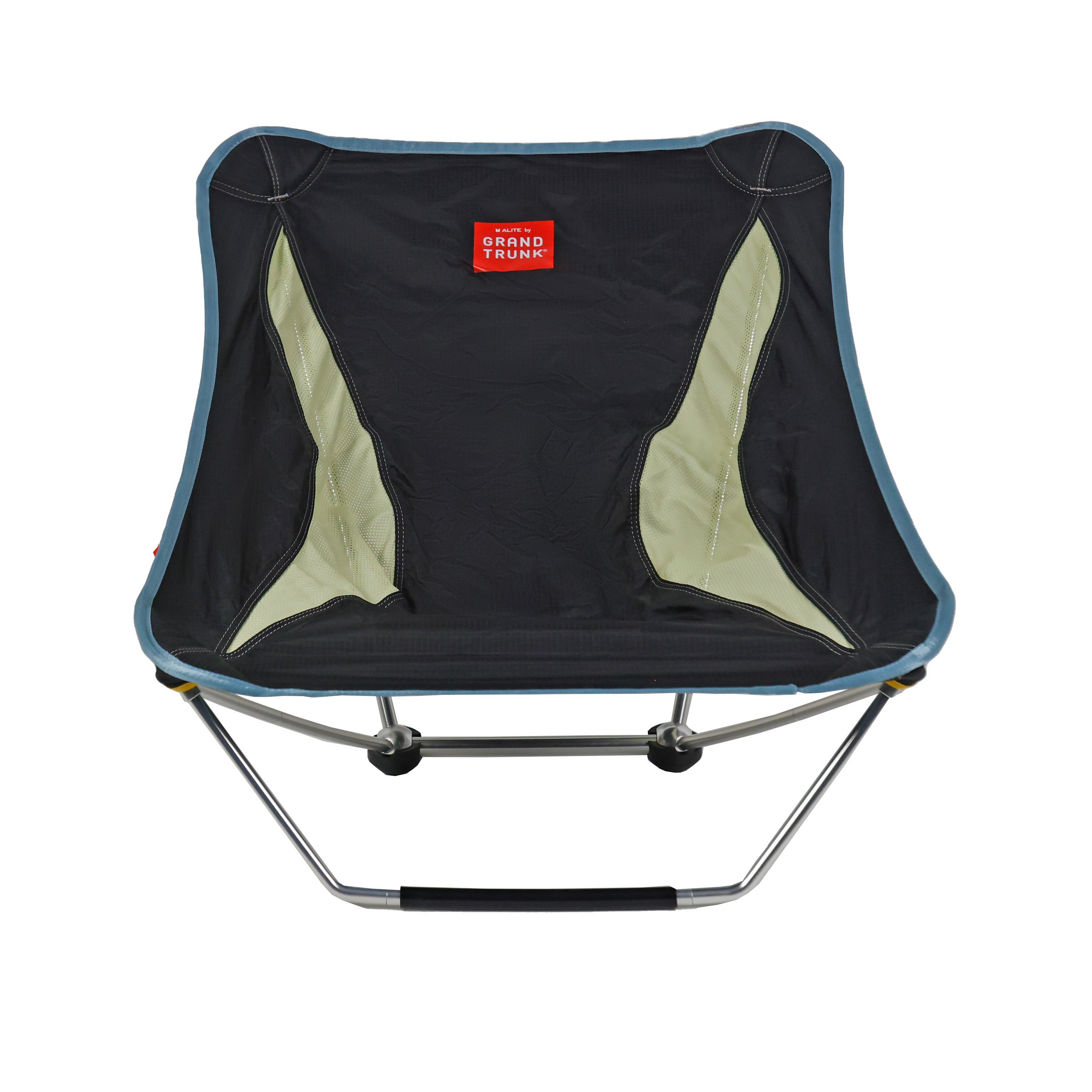 Black Mayfly Low Ground Collapsible Chair by GrandTrunk, shown folded and partially opened, lightweight and portable outdoor seating.
