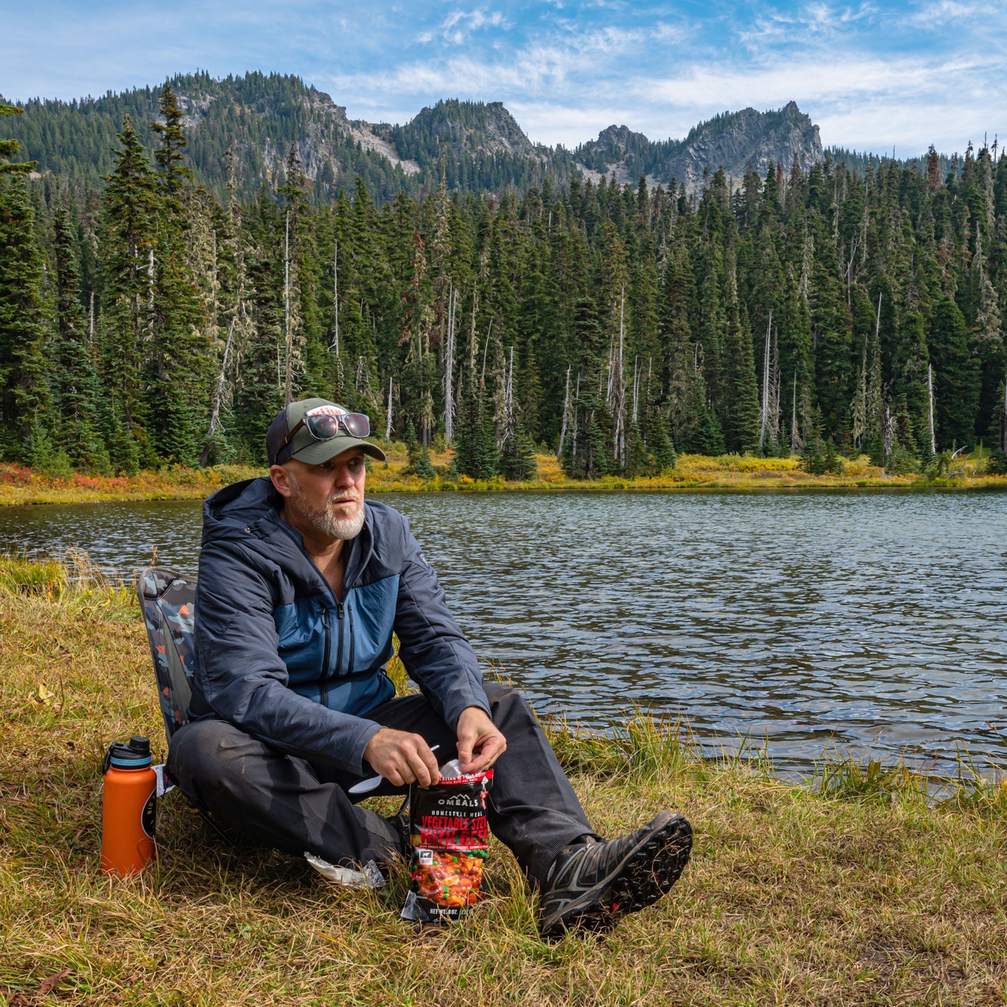 GrandTrunk Mayfly Low Ground Collapsible Chair with lightweight frame and fabric seat, ideal for outdoor camping and relaxation.