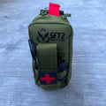 OD green Essential IFAK bag by SFT2 Tactical, designed for medical supplies, showcasing durable fabric and compact design.