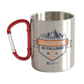 Outdoorzees Adventure Is Calling carabiner mug hanging from a backpack, showing durable metal construction and outdoor-ready design.