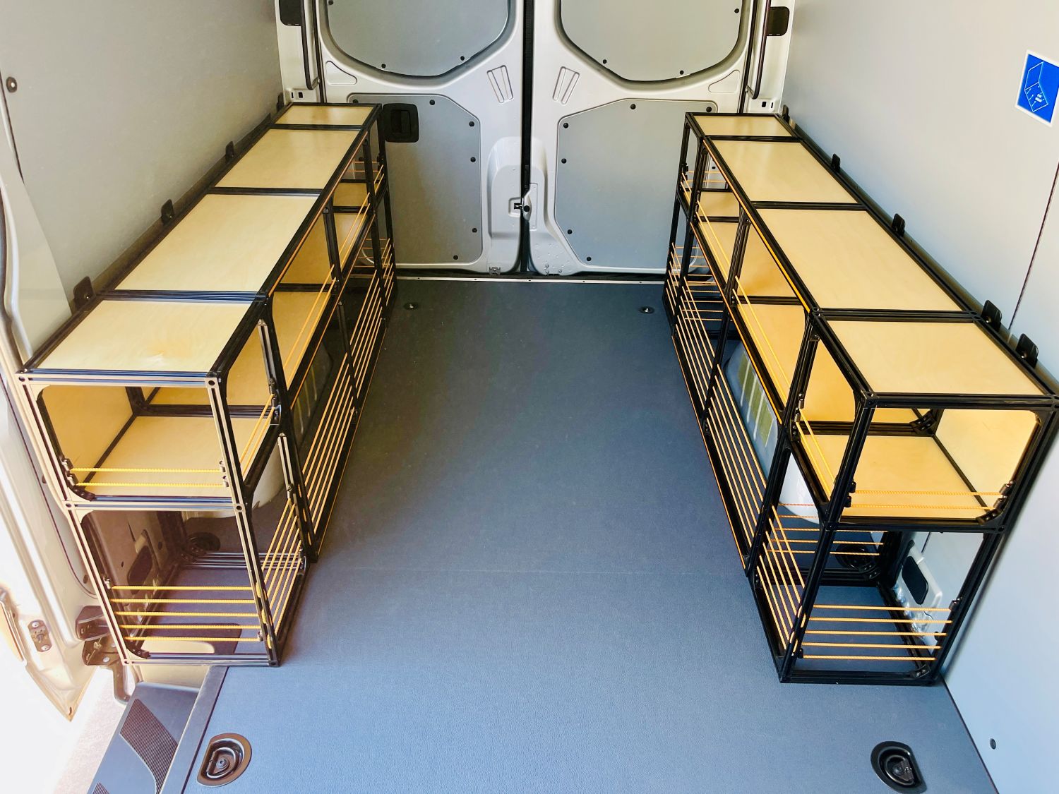 Mercedes Sprinter 144 camper van shelving set by TNTvans for DIY conversion, featuring organized storage solutions.