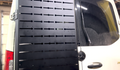 Avatar Offroad Sir Packs-a-lot storage mount installed on the rear door of a Mercedes Sprinter van.