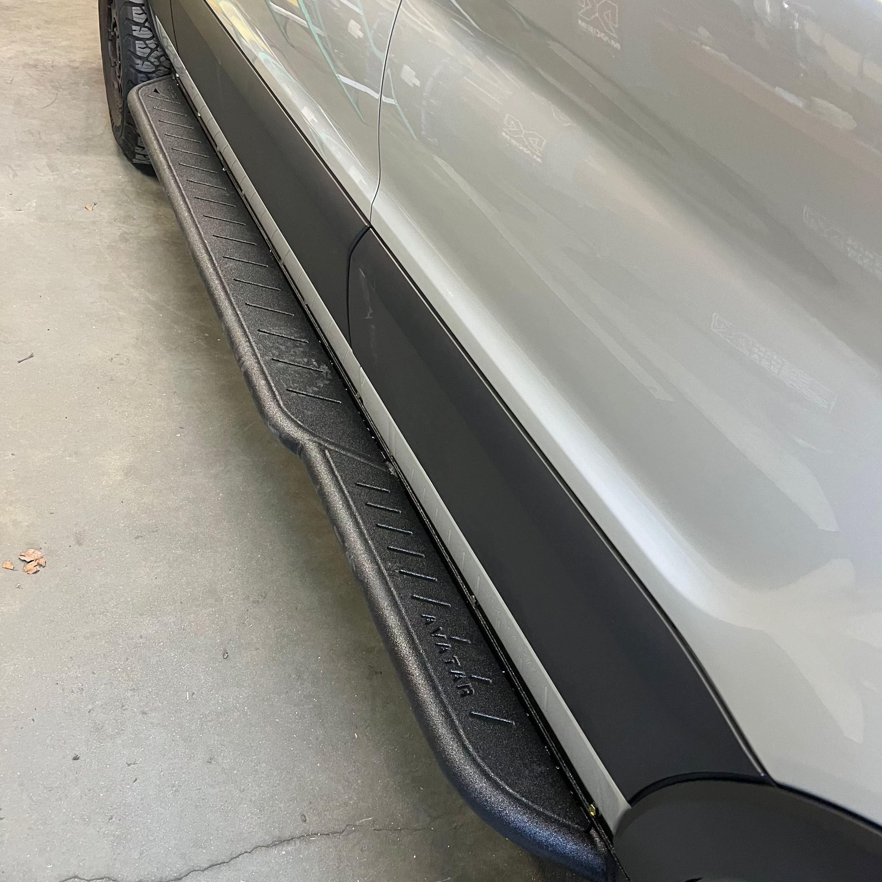 Mercedes Sprinter Rockbody side steps by Avatar Offroad installed on the vehicle, highlighting durable step design and side profile.