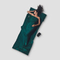 COCOON TravelSheet™ Microfiber in a compact design, showcasing soft texture and lightweight material for travel comfort.