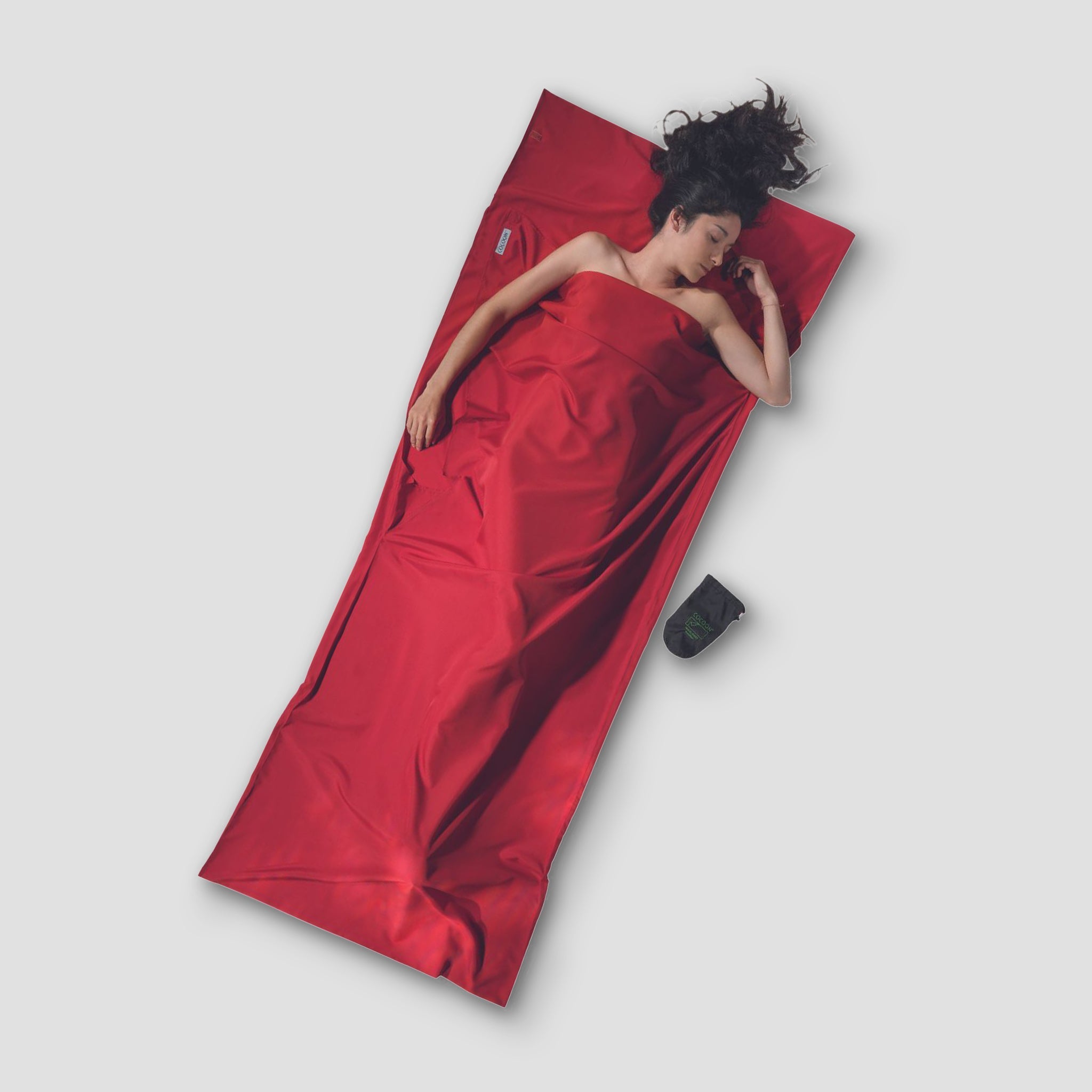 COCOON TravelSheet™ Microfiber in a vibrant color, displayed flat to highlight its soft texture and compact design.