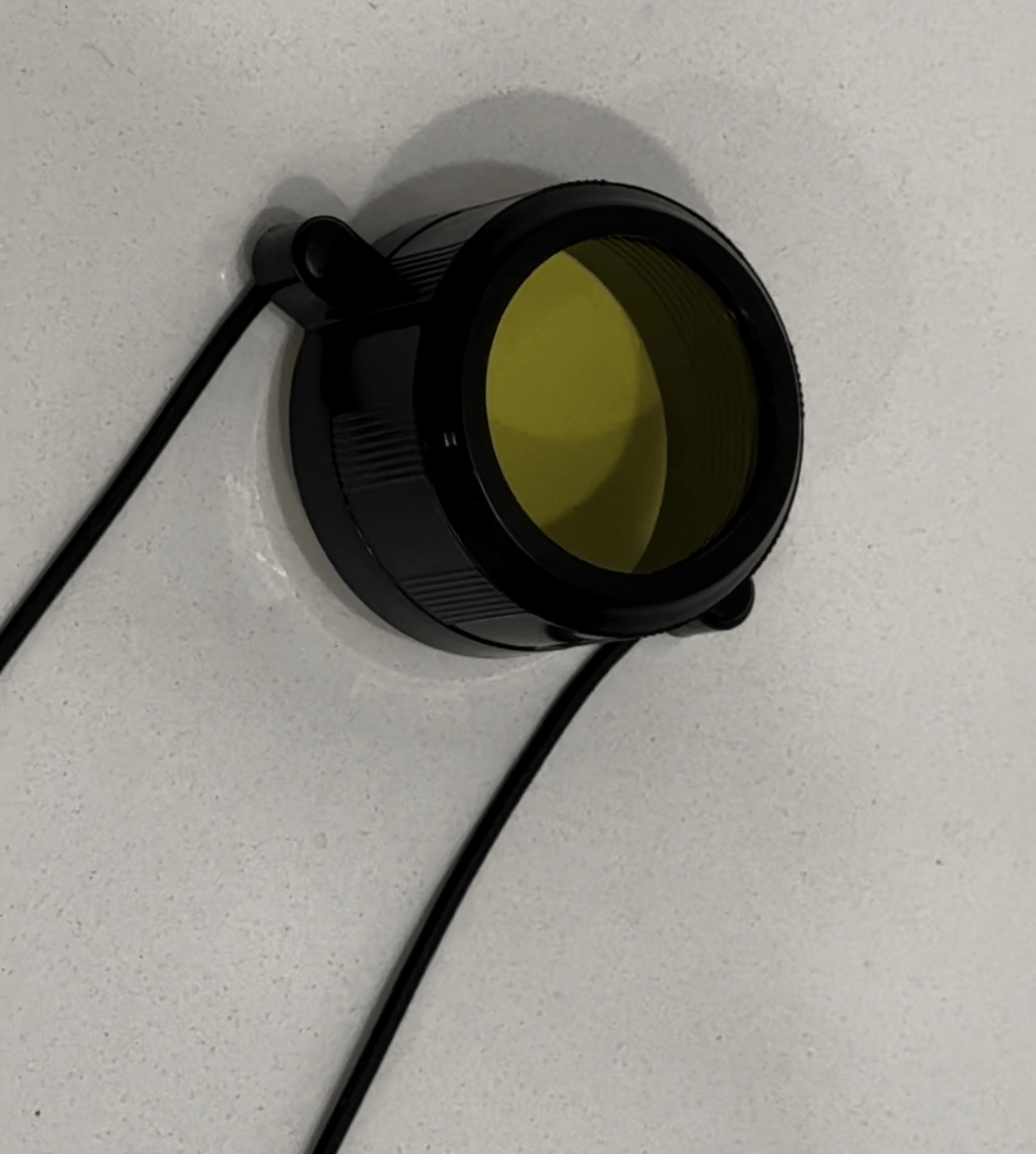 SFT2 Tactical Lens Cover featuring a durable design for protecting lenses in outdoor environments.
