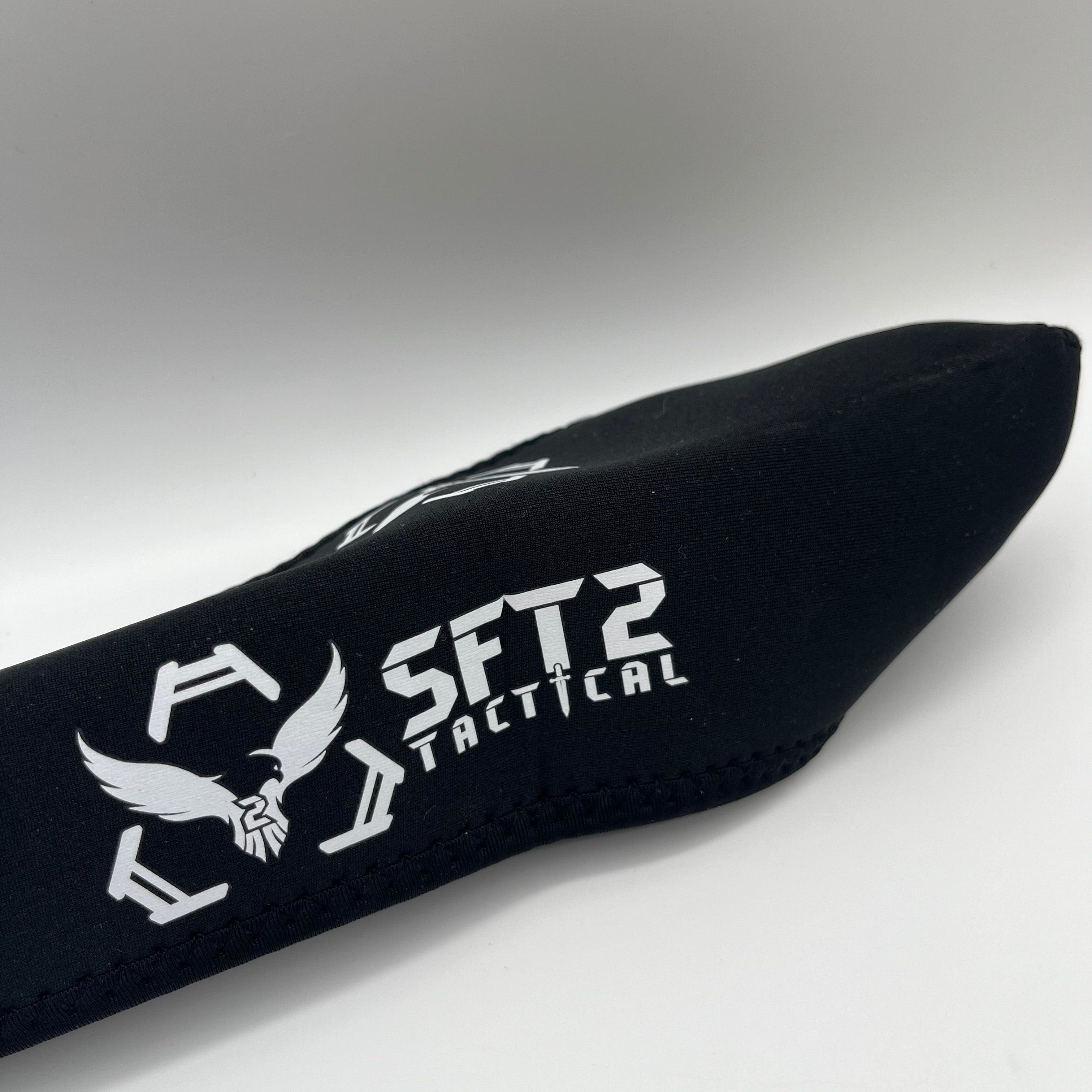 SFT2 Tactical Scope Cover in two sizes, designed for protecting tactical scopes during outdoor use.