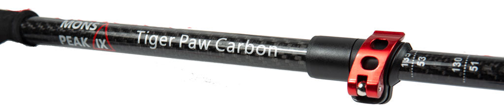 Backcountry Sportsman Tiger Paw Carbon Trekking Poles with ergonomic grips and adjustable shafts for hiking on rugged trails.