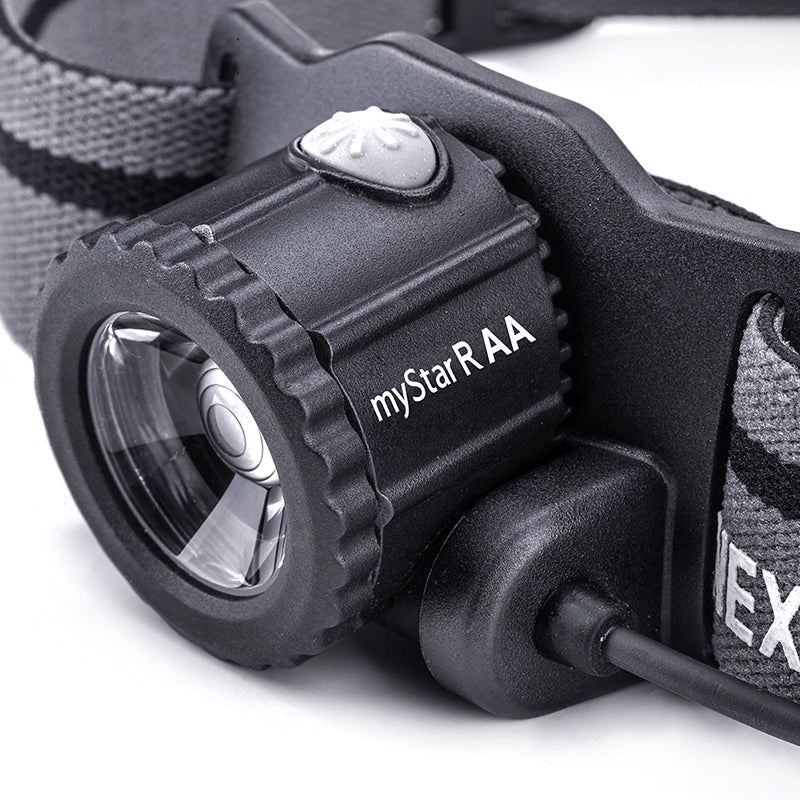 SFT2 Tactical myStar R focusing headlamp mounted on a dark background, showcasing its adjustable beam and compact design.