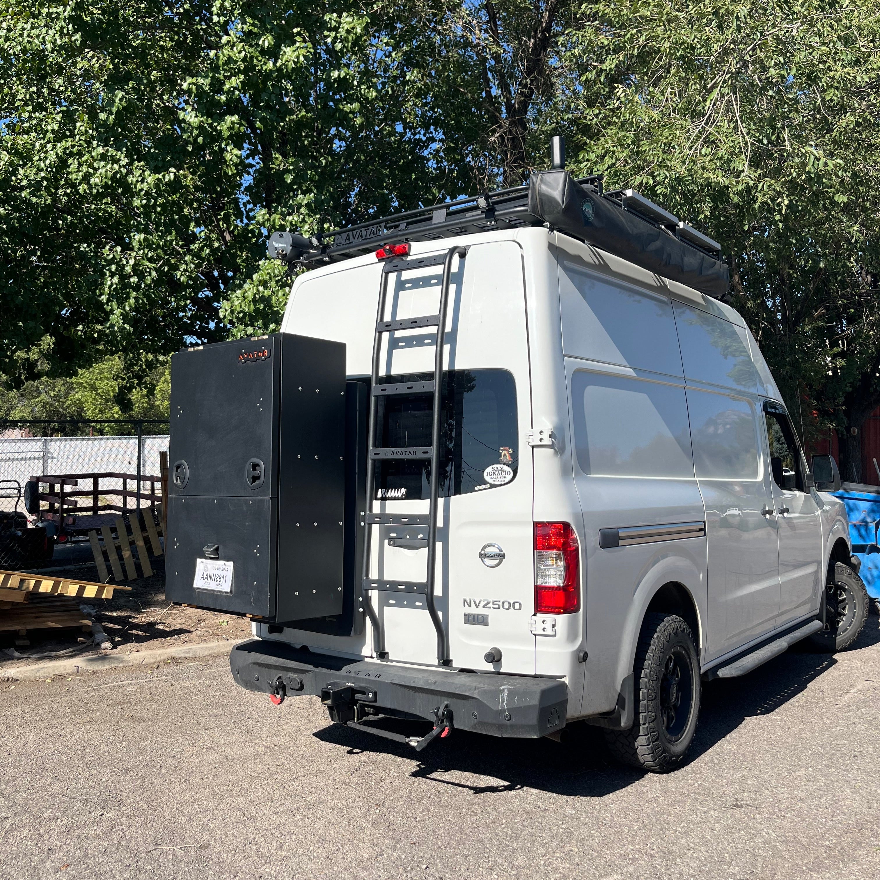 Avatar Offroad NV3500 rear ladder mounted on a Nissan NV, showcasing its sturdy design and practical functionality.