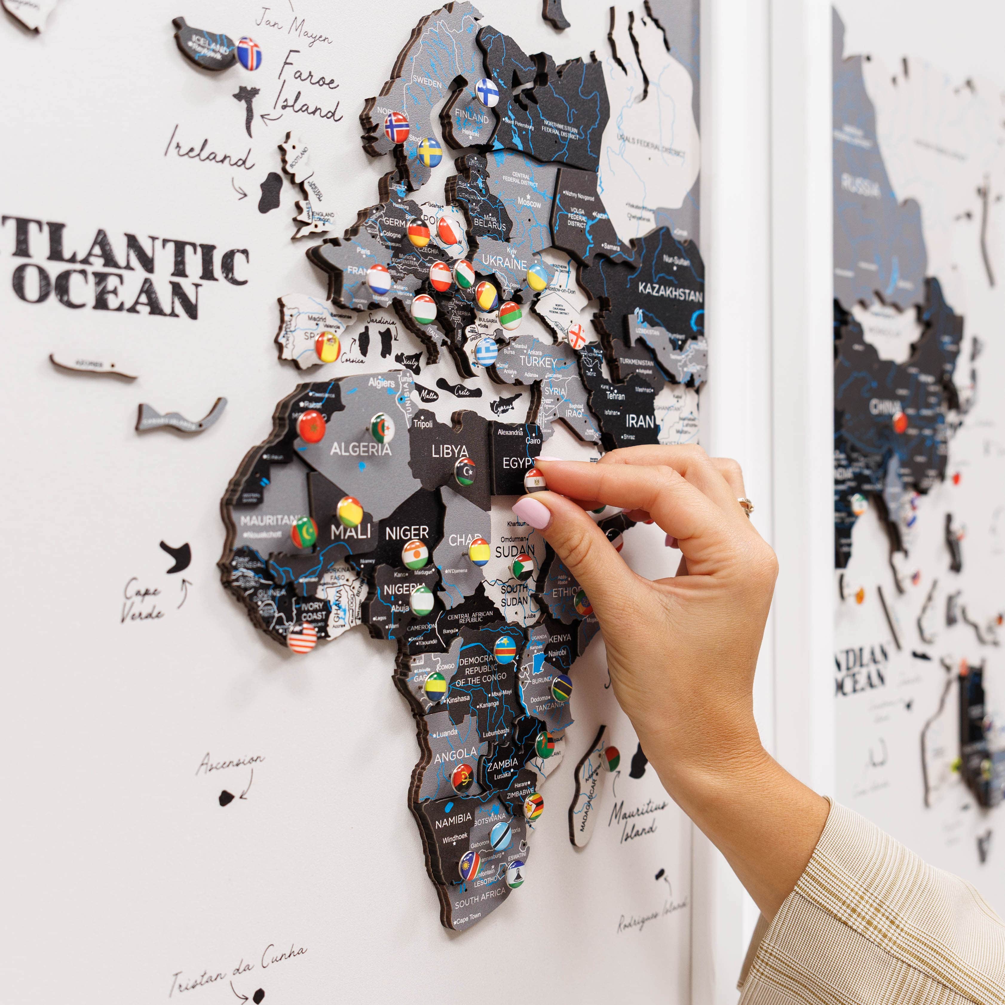Wooden triptych wall art featuring a detailed world map from Enjoy The Wood, displayed in a modern wooden frame.