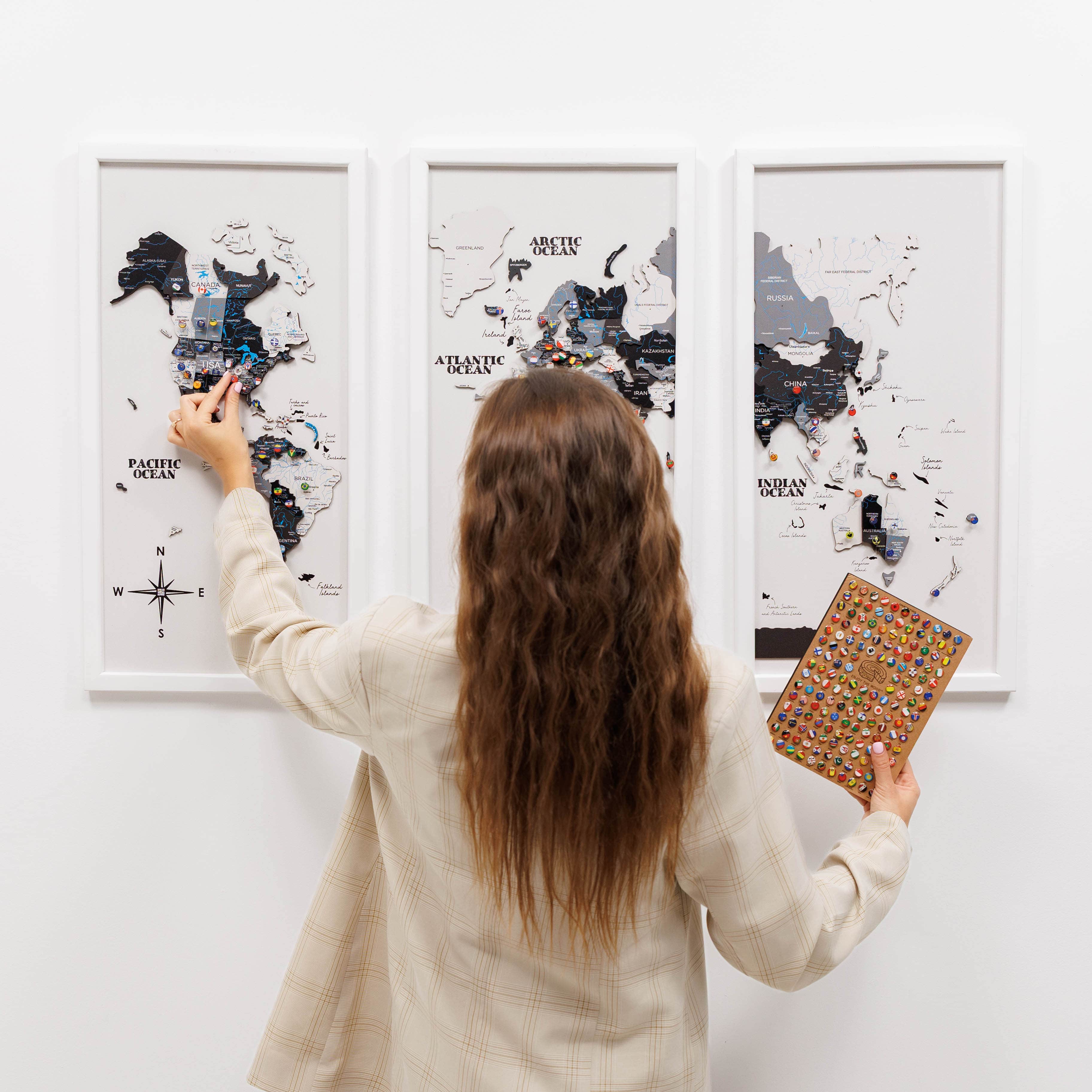 Wooden triptych wall art featuring a detailed world map by Enjoy The Wood, displayed in a modern, natural wood finish.