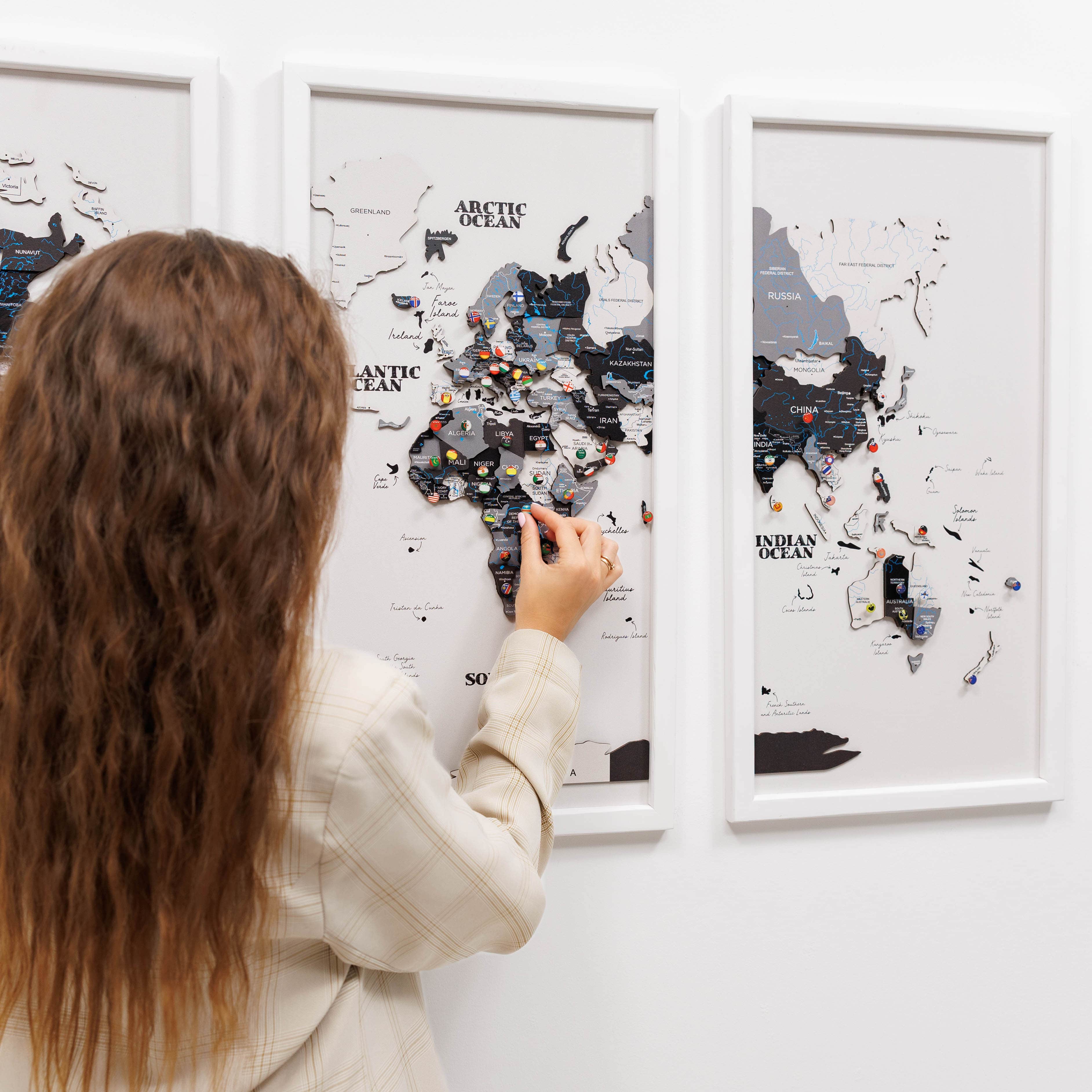 Wooden triptych wall art featuring a detailed world map from Nordik by Enjoy The Wood, displayed in a stylish wooden finish.