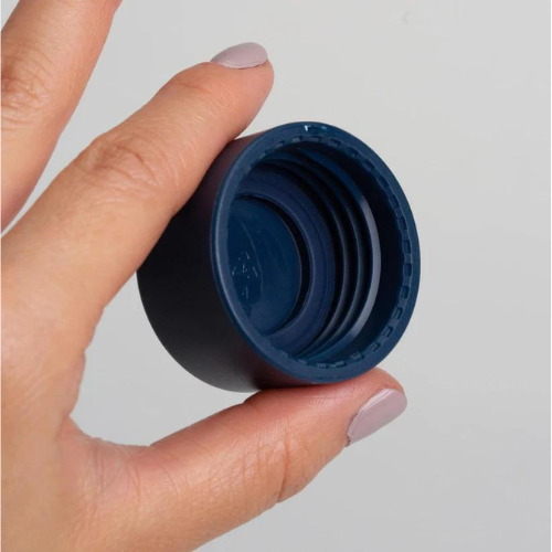 Close-up of the Ocean Bottle insulated water bottle cap by COR Surf, showing the screw-top design for hot or cold beverages.