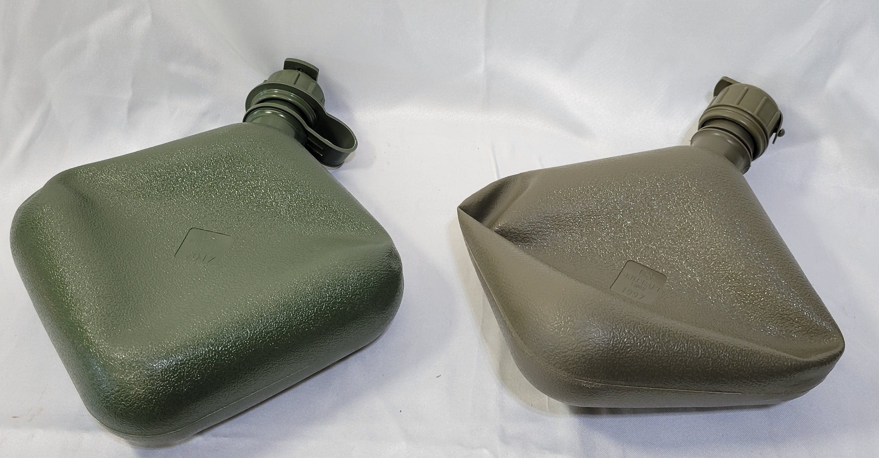 OneThiefSurplus 2-quart canteen with metal cap and durable nylon strap for outdoor activities and hydration.