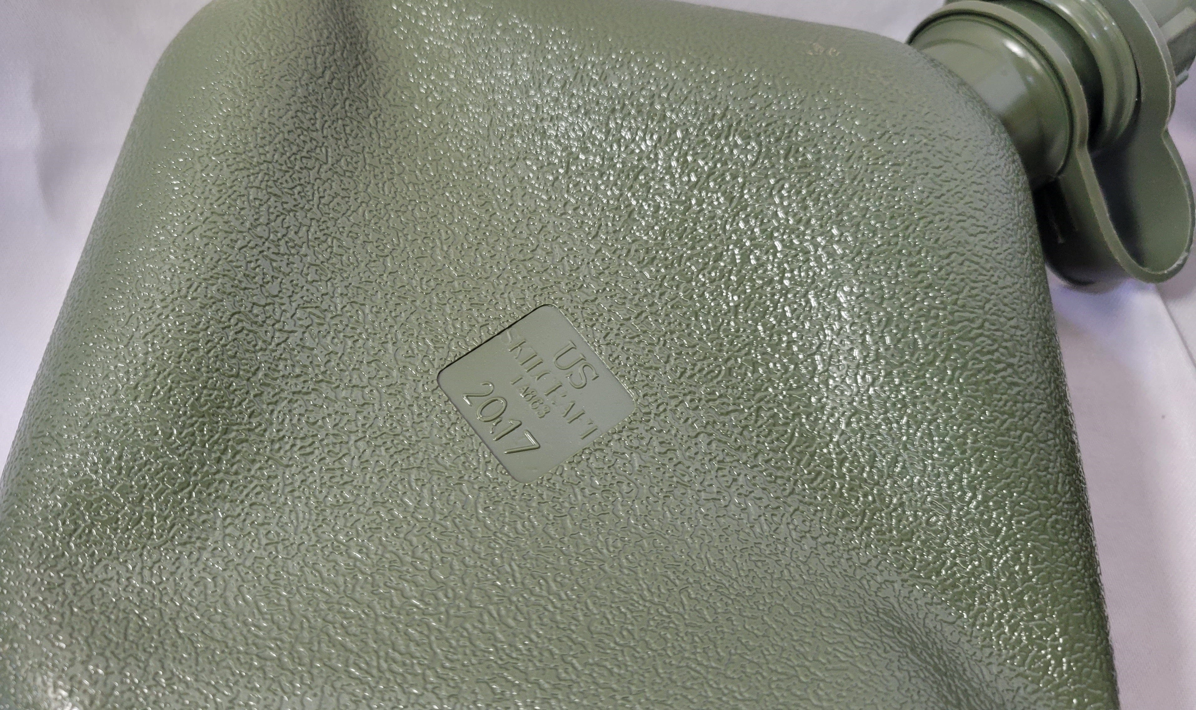 Onethiefsurplus 2-quart metal canteen with black cap and strap, designed for outdoor hydration and camping use.