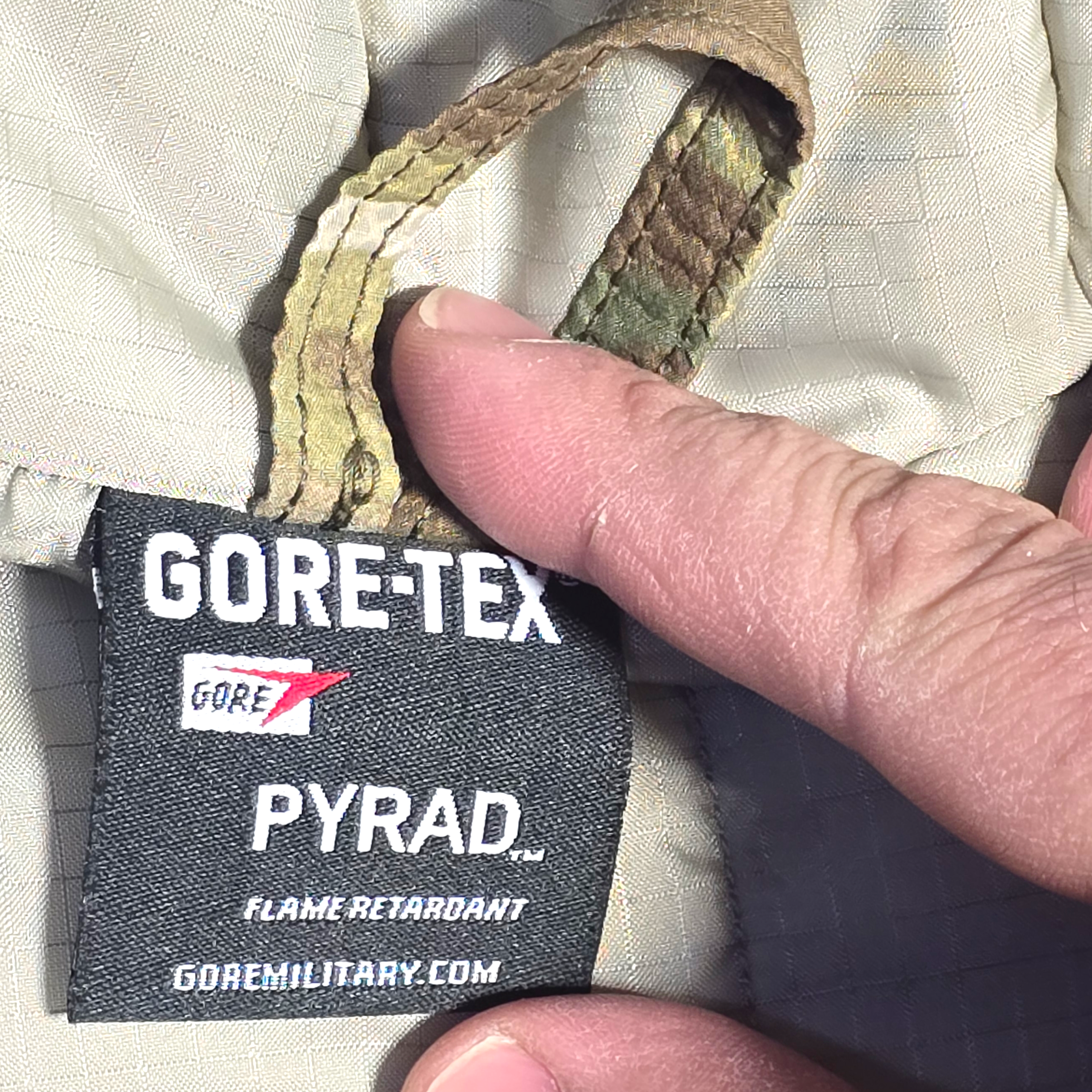 Army OCP FR ECWCS Aircrew Parka, also known as Linebacker Jacket, in camouflage fabric, suitable for camping and hiking.