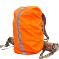 Blaze orange backpack cover with reflective stripe for camping and hiking, designed to protect backpacks outdoors.