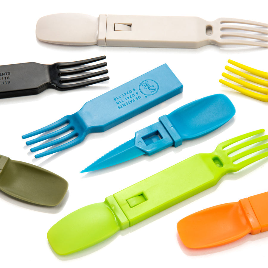 Onethiefsurplus camping and hiking fork, knife, and spoon utensil set with stainless steel tools on a outdoor camping table.