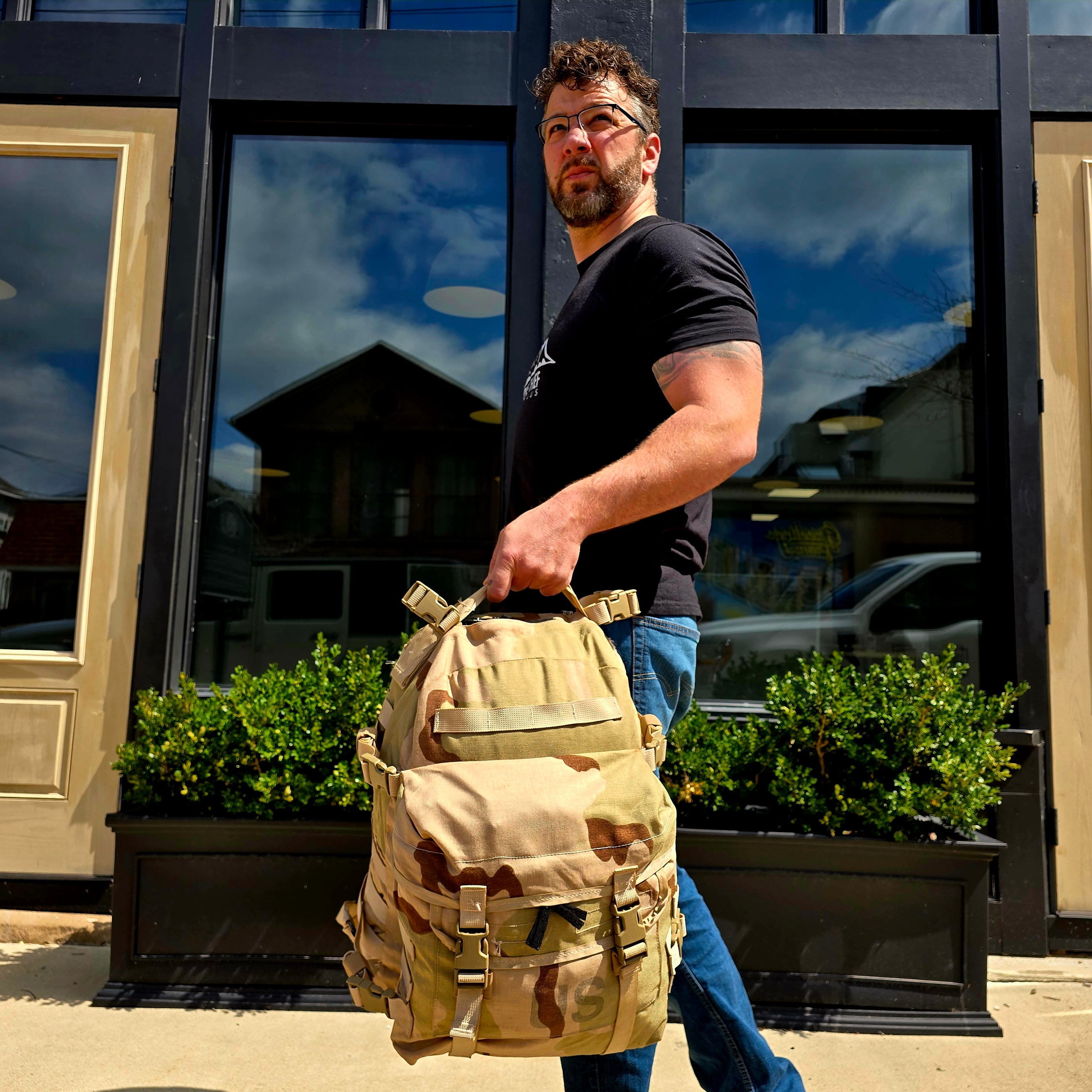 Onethiefsurplus MOLLE II Assault Pack in DCU camouflage with multiple compartments and straps for camping and hiking gear.