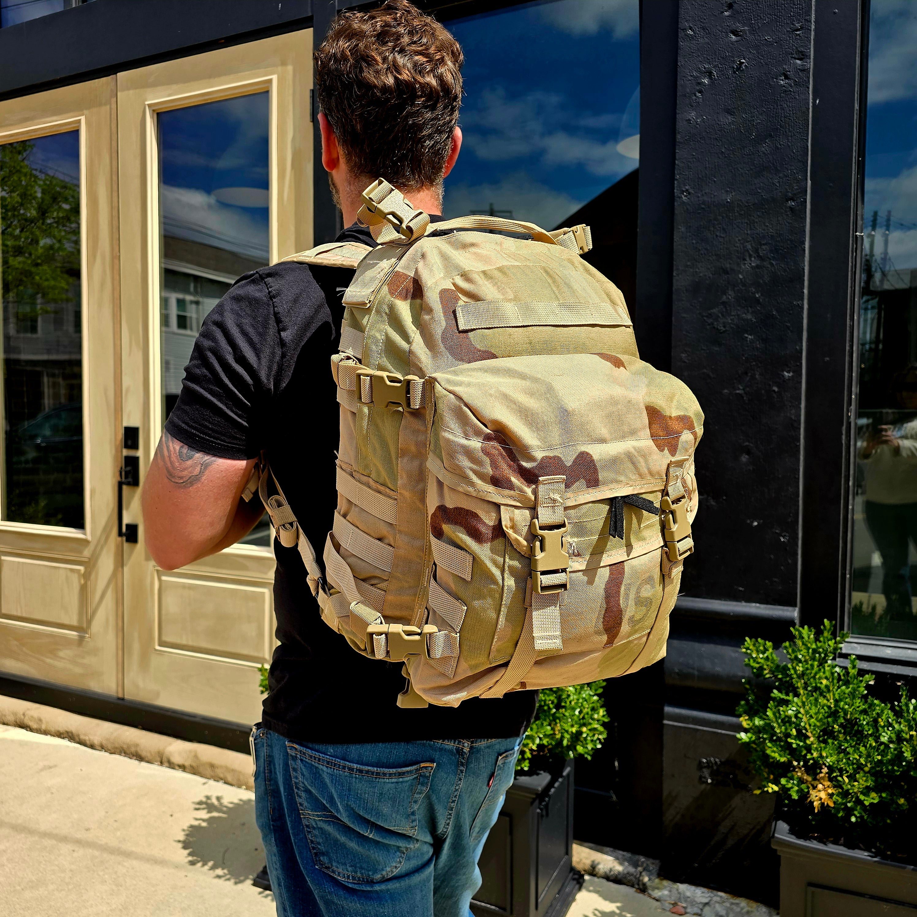 Onethiefsurplus MOLLE II Assault Pack in DCU camouflage, rugged camping and hiking backpack with multiple compartments and MOLLE webbing.