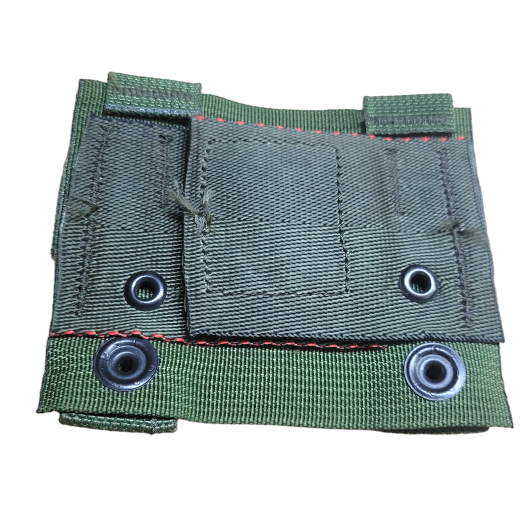 Black K-Bar MOLLE adapter from onethiefsurplus with durable nylon straps and metal clips for tactical gear attachment.