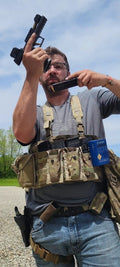 Multi-cam tactical assault panel by onethiefsurplus showing adjustable straps and MOLLE webbing for tactical gear attachment.