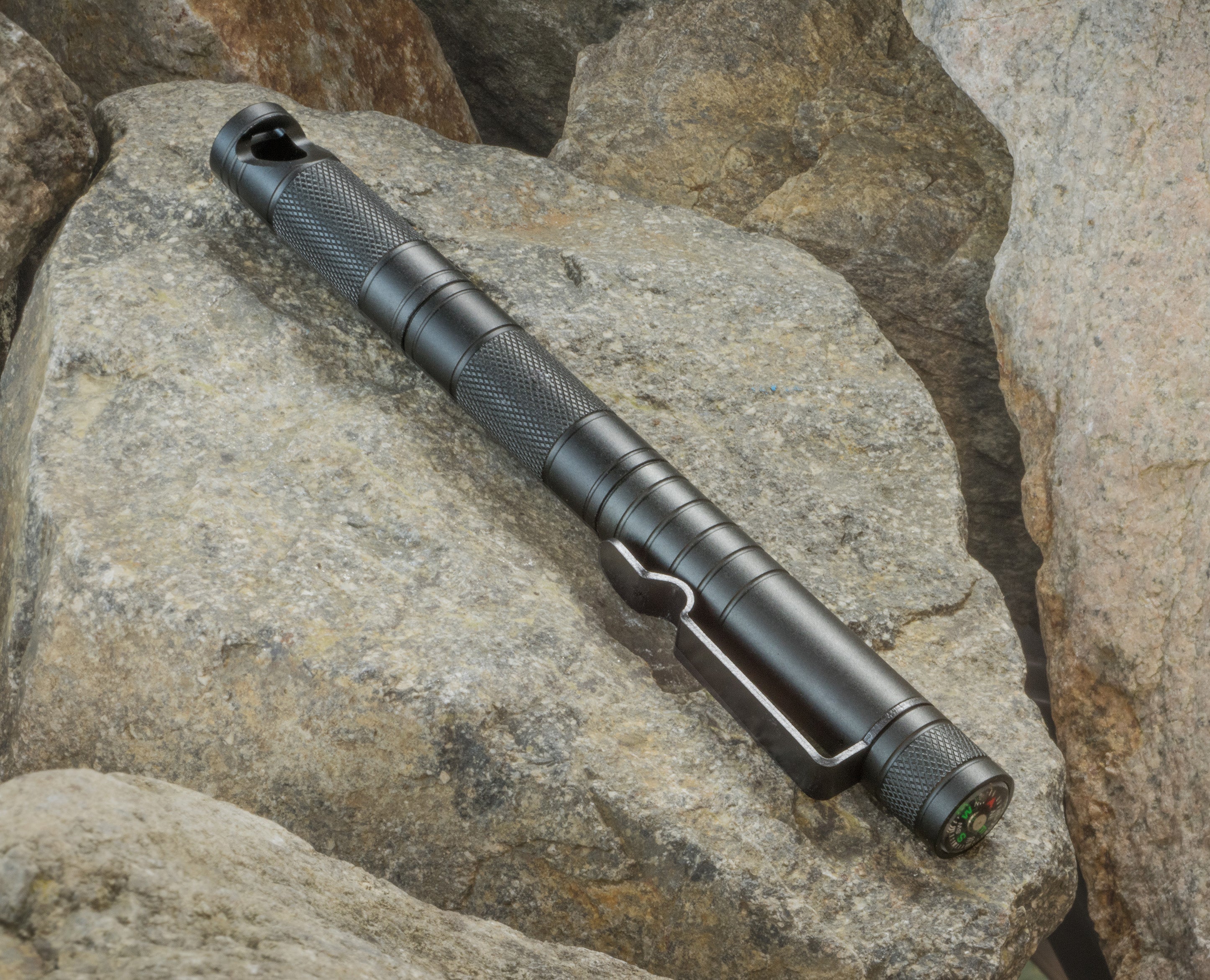 Compact 5-in-1 survival tool with tactical pen, including multiple functions for outdoor camping and backpacking.