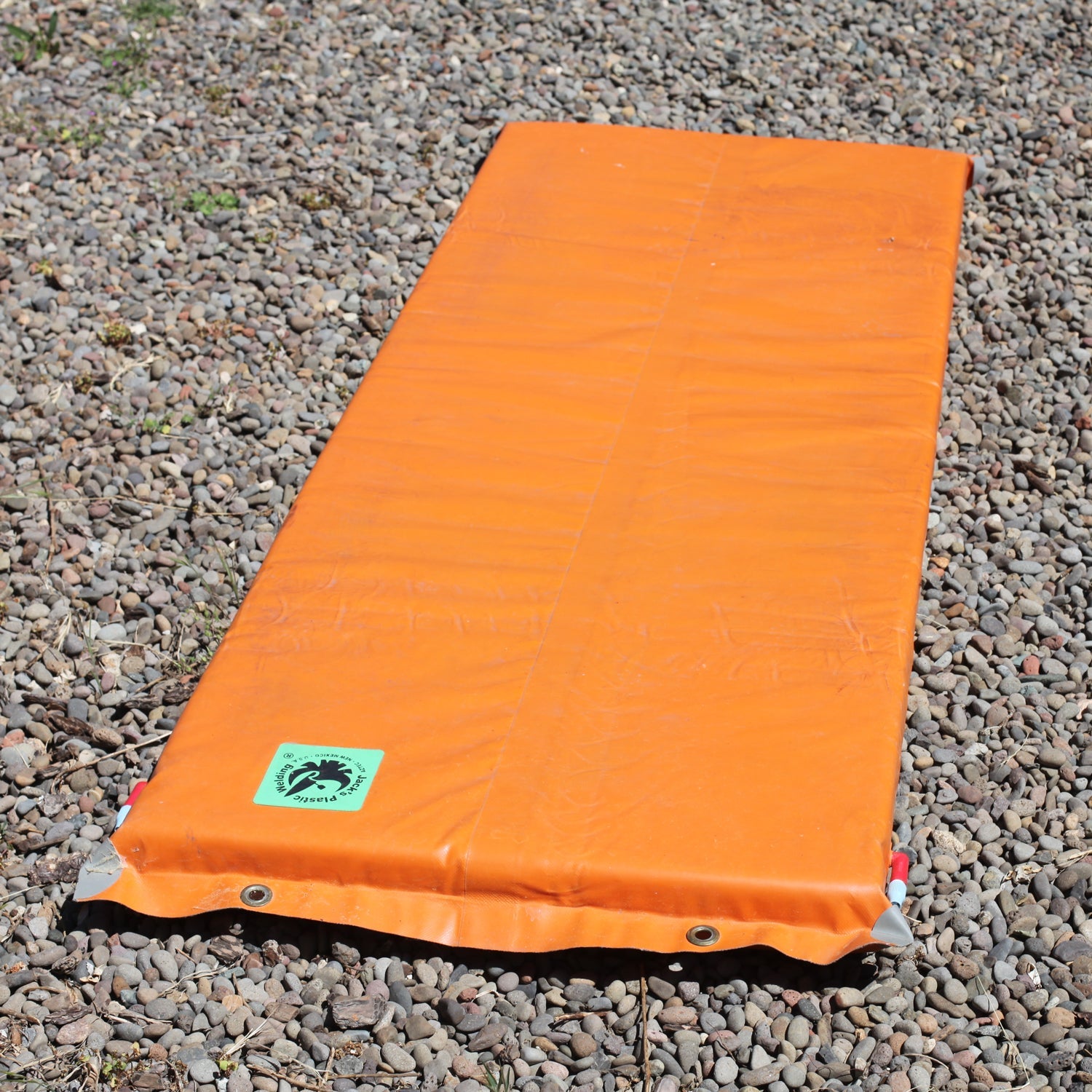 Jack's Welding Full Paco Pad by OVERLANDERS Outfitter, a durable sleeping pad with a textured surface for comfort.