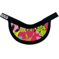 A semi-circular visor with a vibrant pink, green, and yellow abstract floral pattern, featuring a black fabric trim and a black adjustable strap with a 'Porta Mare' brand tag.