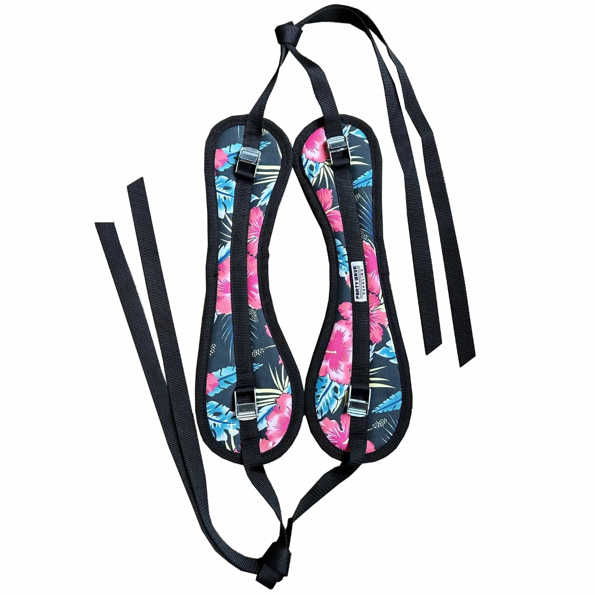 A pair of padded shoulder harness covers with a vibrant tropical floral and palm leaf print in pink, blue, and green, featuring black straps and buckles, shown on a plain white background.