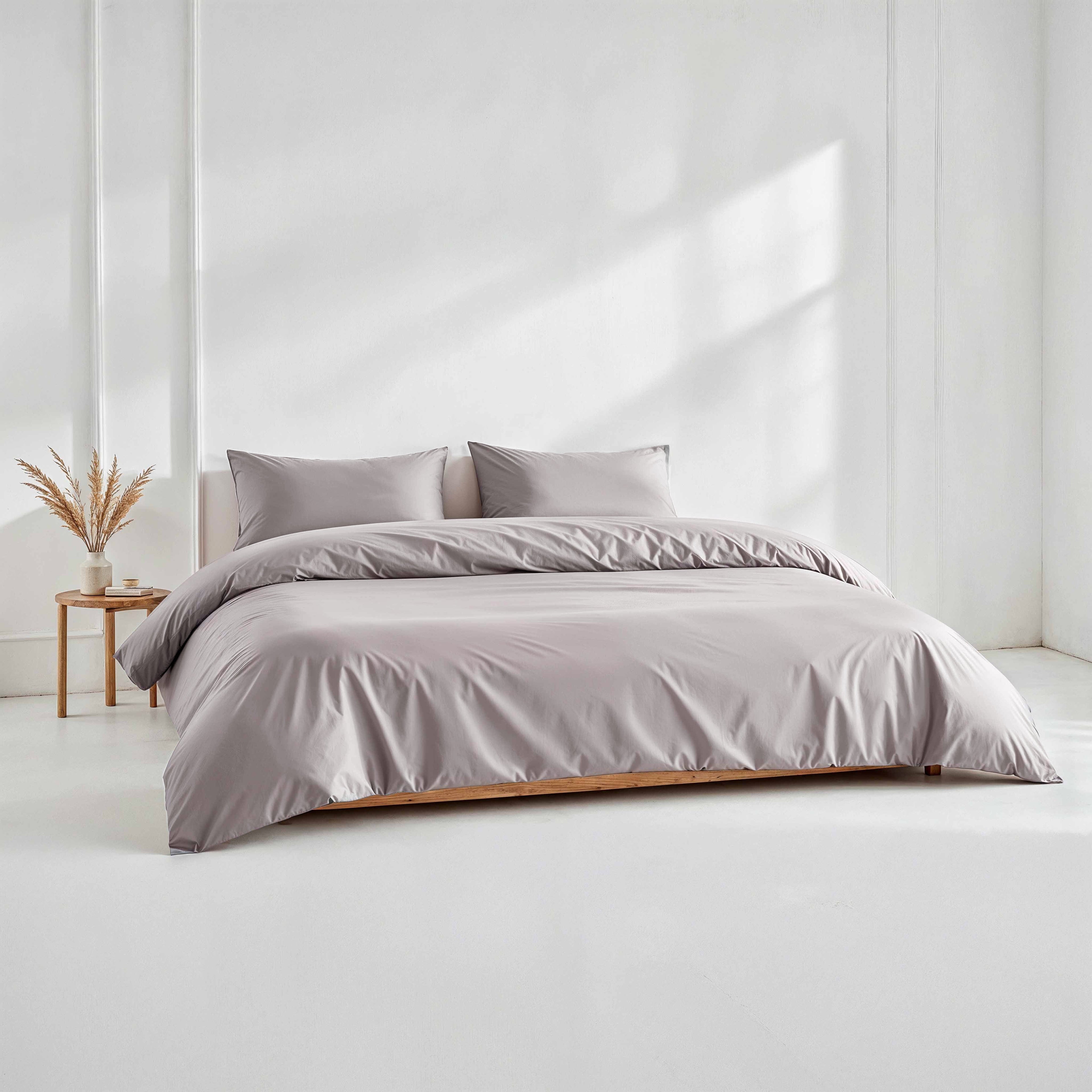 Gray Luxe Australian Sateen duvet cover from Italic, showing smooth, luxurious fabric on a neatly made bed.