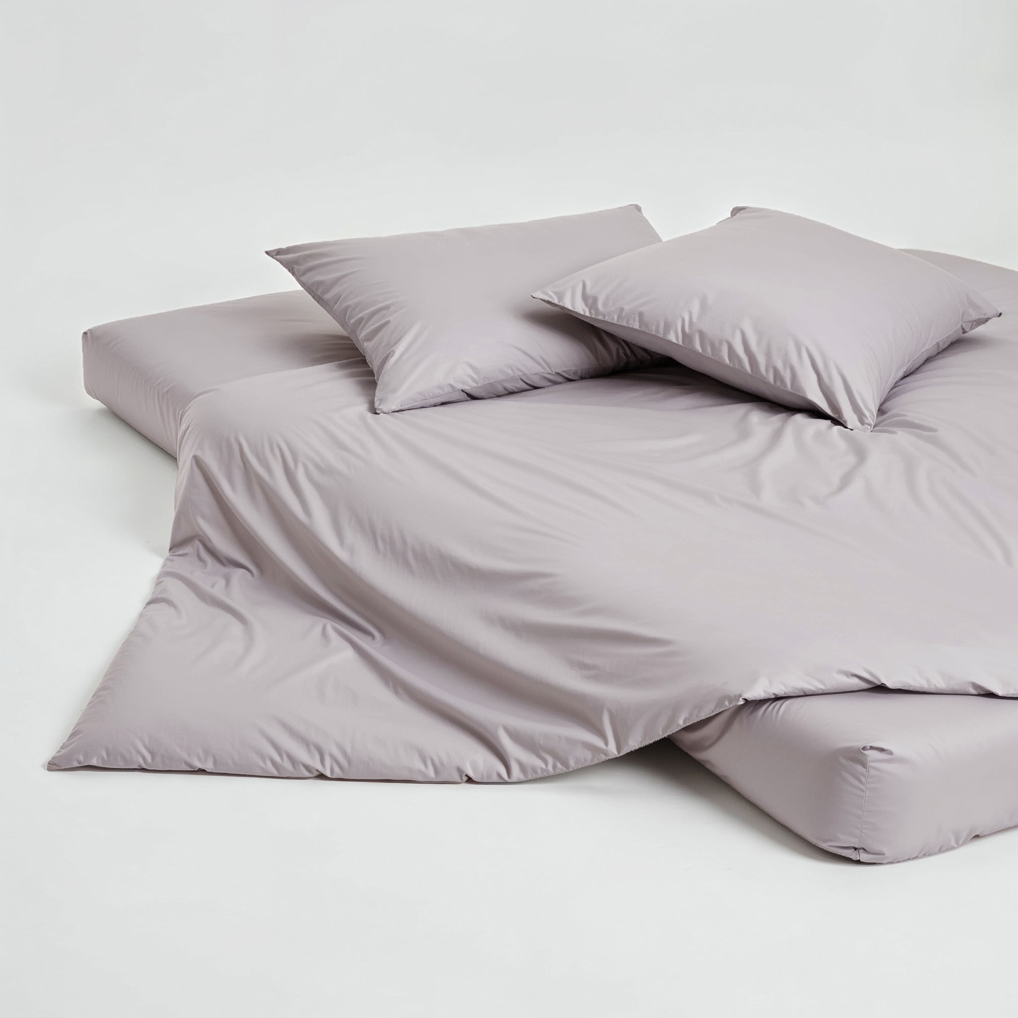 Luxe Australian sateen duvet cover in pebble gray from Italic, showcasing smooth, soft fabric and elegant bed bedding.