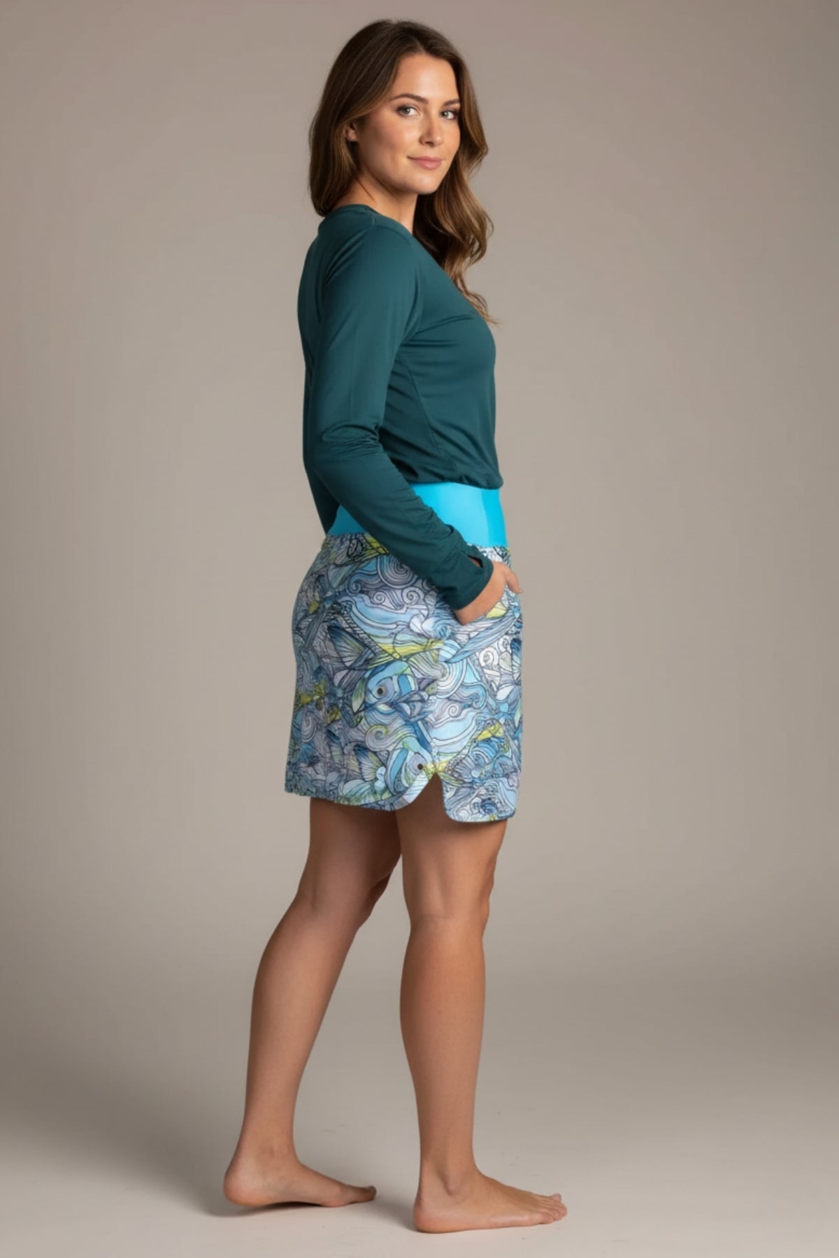 FisheWear Permit Paradise Skort showing lightweight fabric, floral pattern, and comfortable elastic waistband on a model.