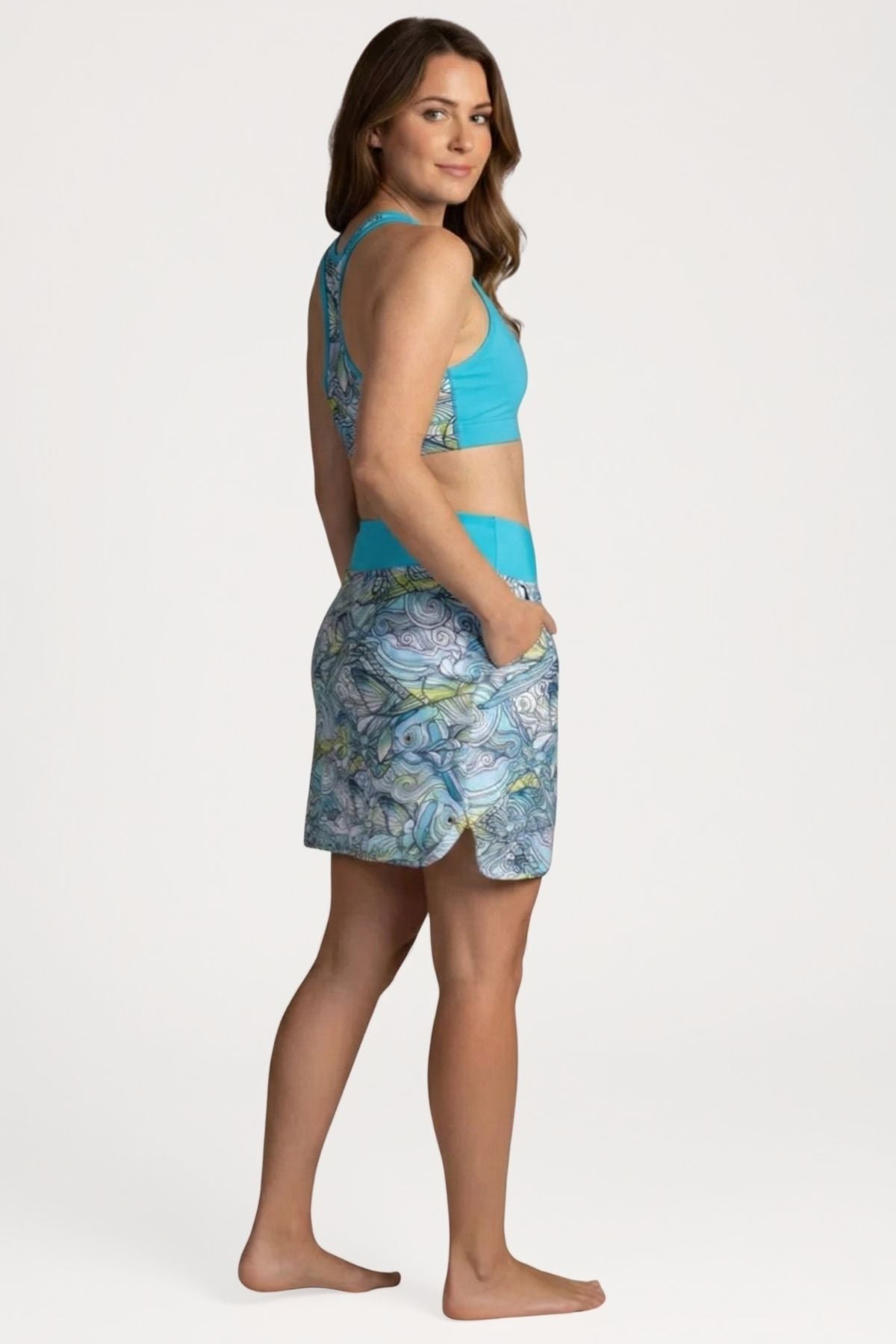 FisheWear Permit Paradise sports bra featuring vibrant tropical print, supportive design, and breathable fabric for active wear.