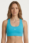 FisheWear Permit Paradise sports bra featuring a vibrant print, supportive design, and breathable fabric for active wear.